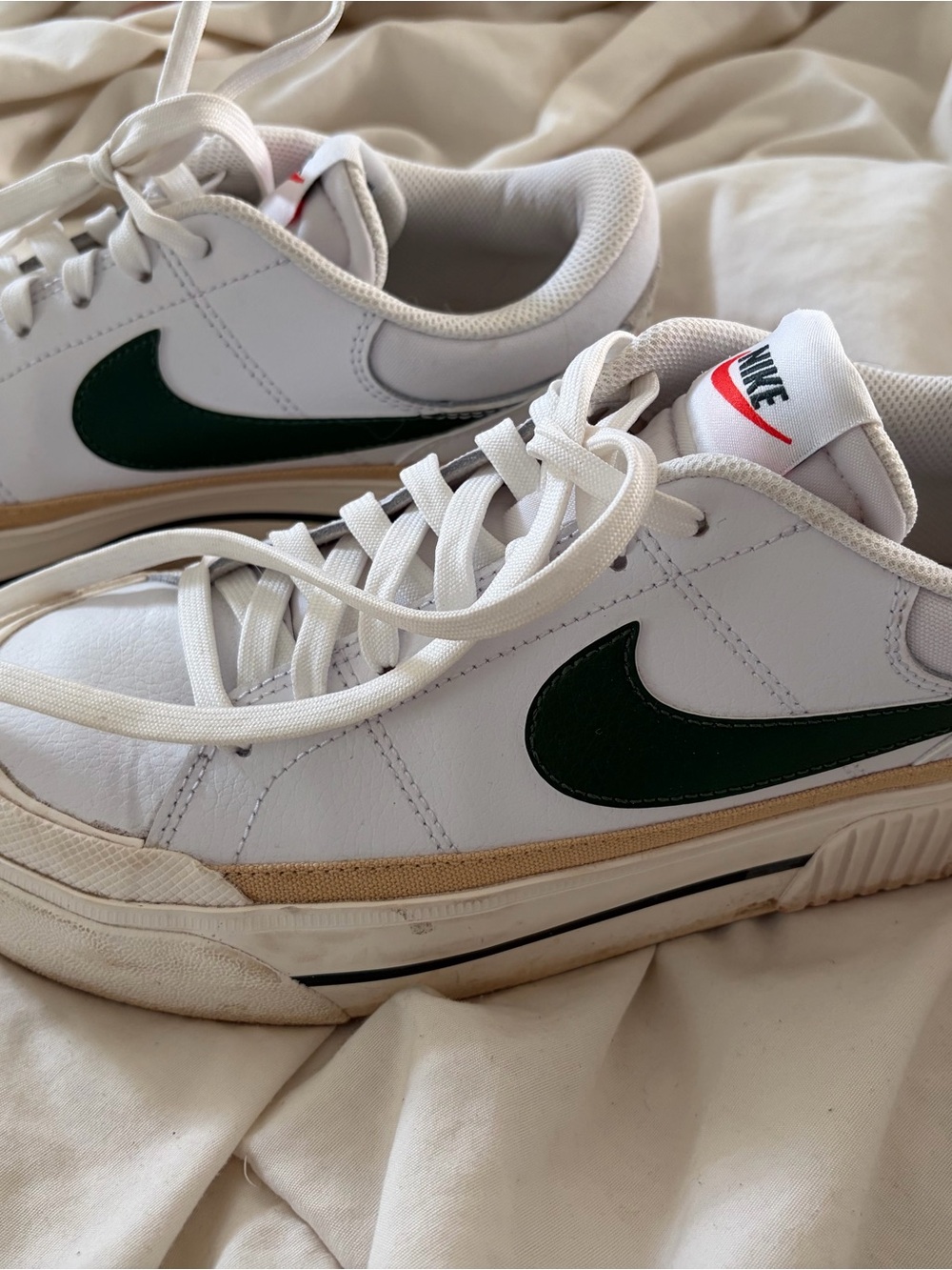 Nike Women’s White Sneakers with Dark Green Swoosh